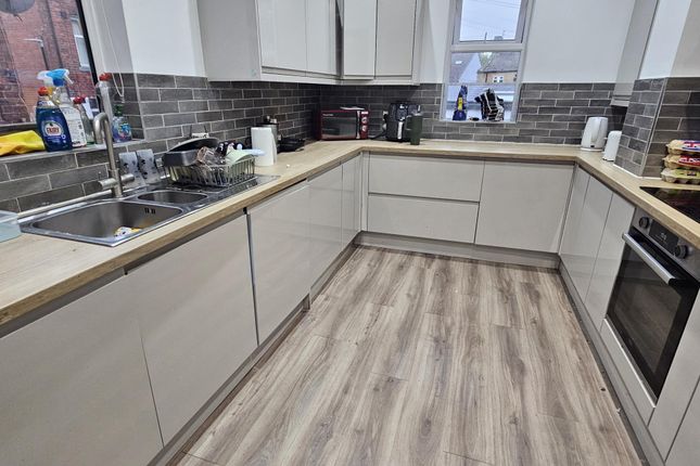 A Modern, Well-Maintained Kitchen With Light-Color...