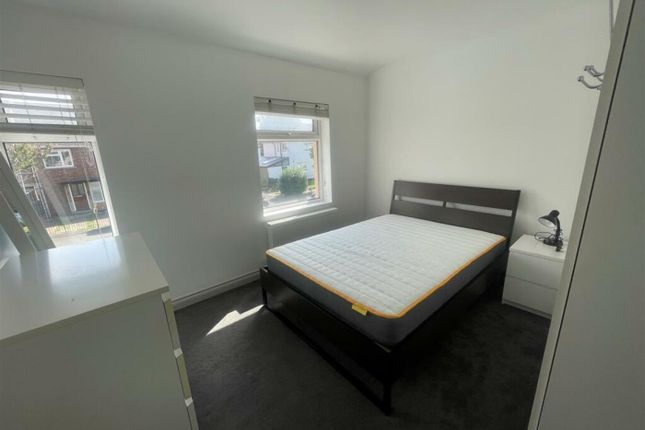 A Clean And Bright Double Bedroom With Large Windo...