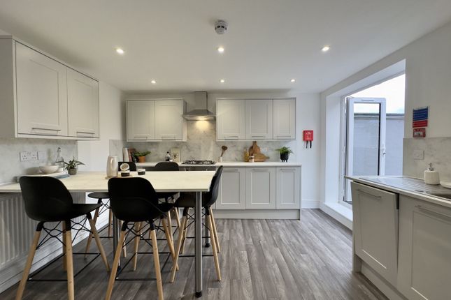 A Modern And Spacious Kitchen With Ample Natural l...