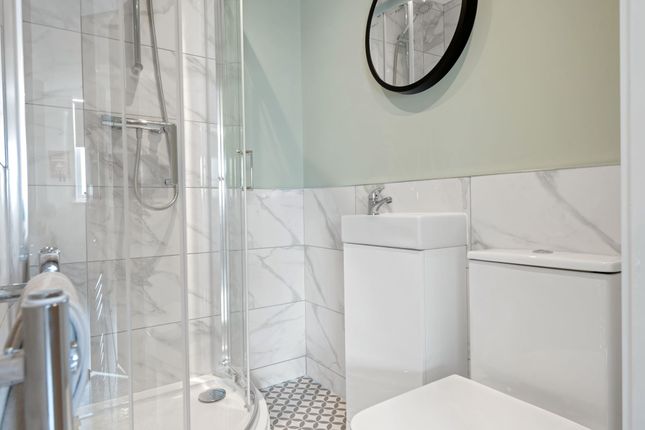 Modern, Clean Bathroom With A Spacious Shower Encl...