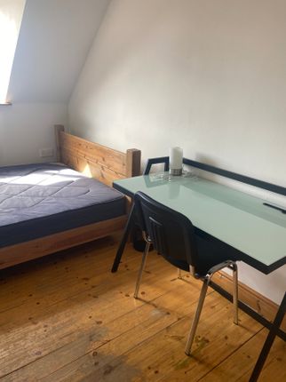 A Cozy Double Bedroom Featuring A Comfortable Bed ...