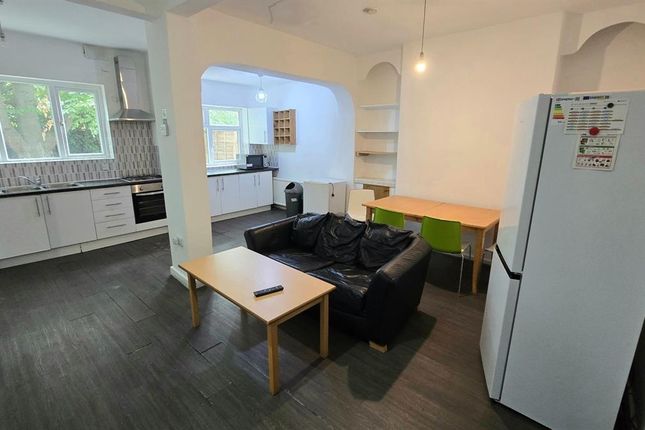 Open-Plan Living Space With A Comfortable Black So...