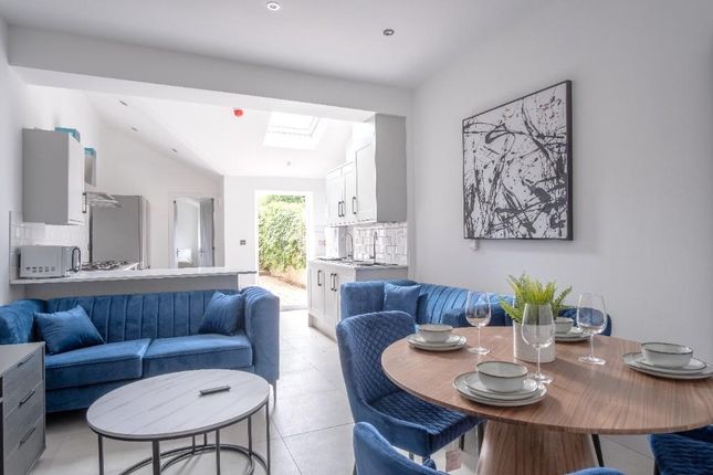 Bright And Modern Living Room Featuring Comfortabl...