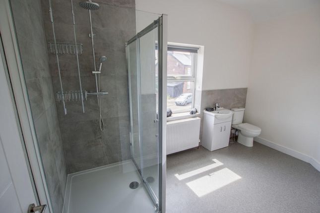 Bright And Modern Bathroom Suite Featuring A Spaci...