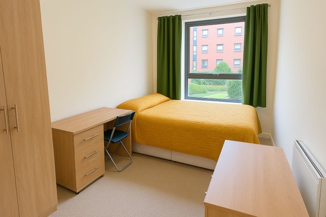 A Bright And Welcoming Single Bedroom Featuring A ...