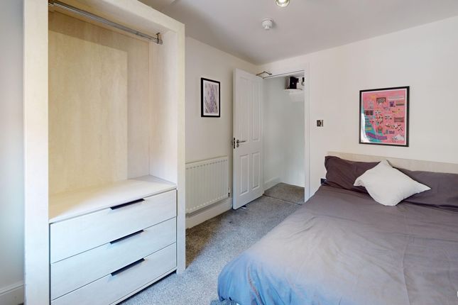 A Cozy And Tidy Double Bedroom Featuring A Comfort...