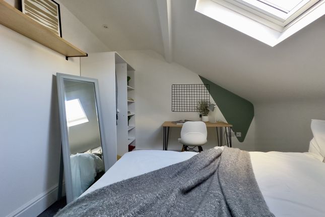 A Bright And Tidy Double Bedroom Featuring A Comfo...