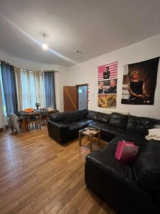 A Spacious, Well-Lit Living Room Featuring A Large...