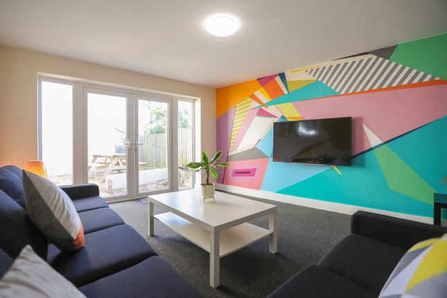 Bright And Contemporary Living Room Featuring Larg...