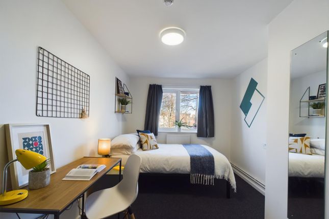 A Bright And Inviting Double Bedroom Featuring A c...