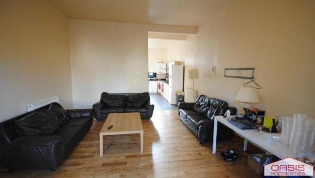 A Spacious, Well-Lit Living Room Featuring Contemp...