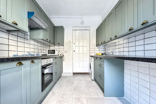 Bright And Modern Kitchen Featuring Sleek Cabinetr...