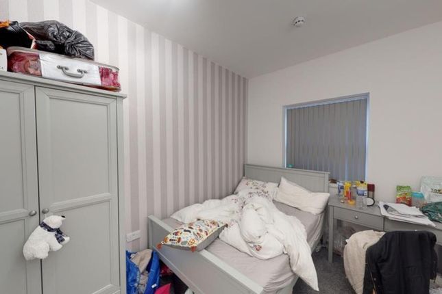 A Cozy Double Bedroom With A Comfortable Bed And P...