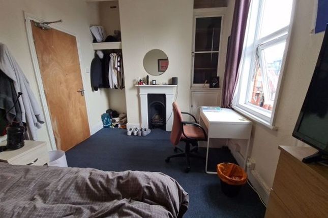 A Bright And Welcoming Living Room Featuring A Lar...