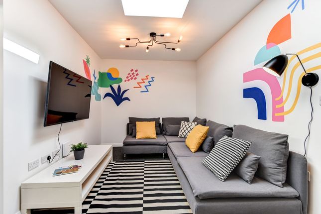 This Vibrant Communal Lounge Boasts Modern Decor W...