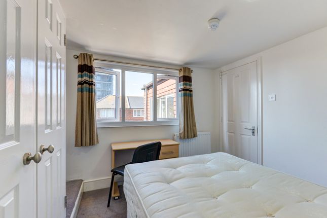 Bright And Inviting Master Bedroom Featuring A Lar...