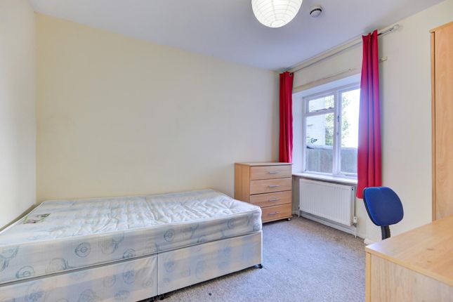 A Bright And Simple Single Bedroom Featuring A Win...