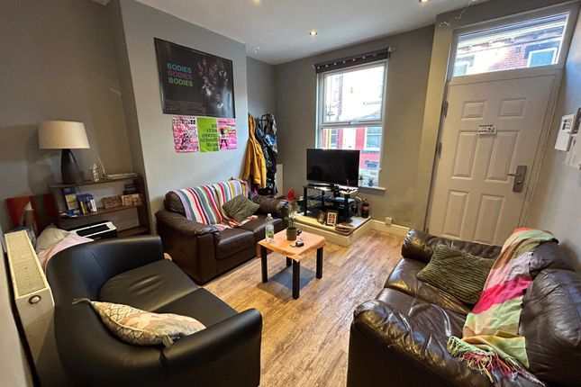 A Bright And Inviting Living Room With Comfortable...