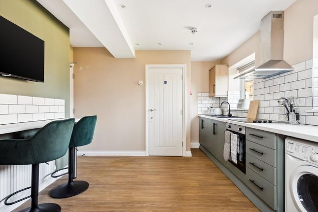 This Stylish Kitchen Features Modern Appliances, A...
