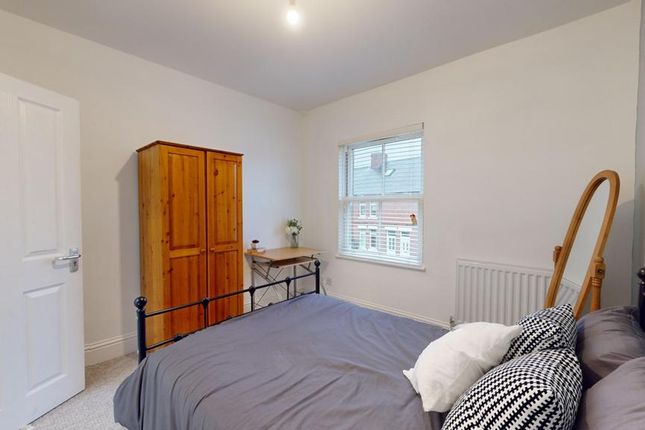 A Bright And Inviting Double Bedroom With Ample Na...