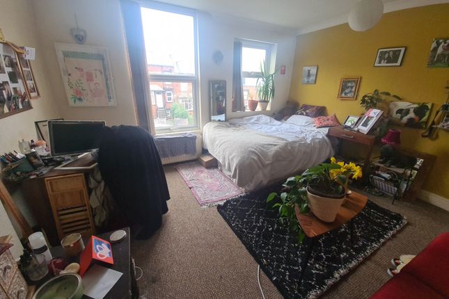 Bright And Welcoming Living Room Featuring Large W...