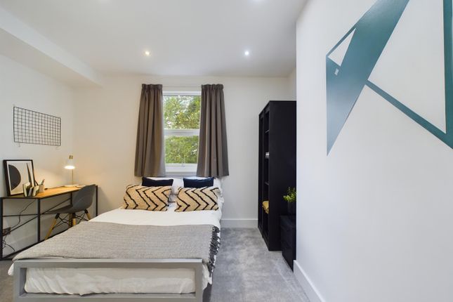 A Bright And Inviting Double Bedroom Featuring Sty...