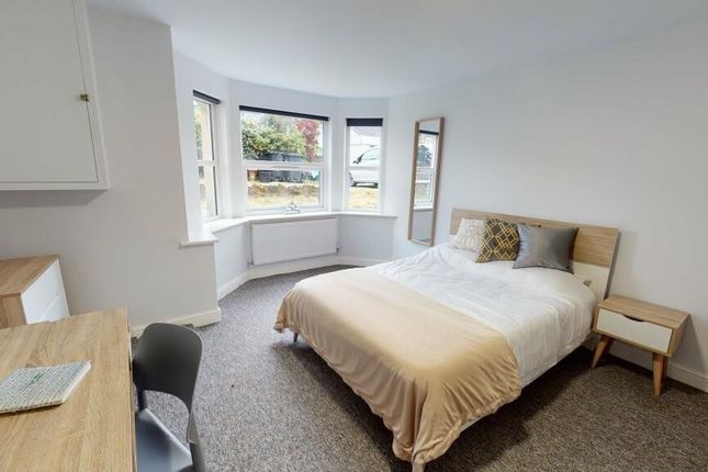 Bright And Inviting Double Bedroom Featuring A Com...