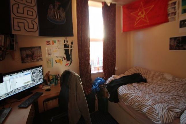 Cozy Single Bedroom Featuring A Comfortable Bed Wi...