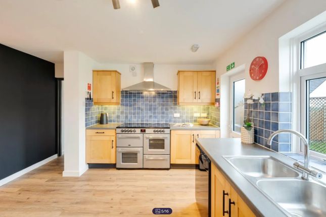A Spacious And Modern Kitchen With Ample Natural l...