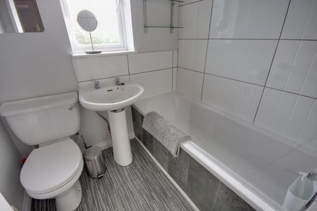 A Modern And Tidy Bathroom Featuring A Clean Desig...