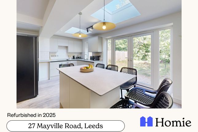 A Bright And Modern Kitchen With Large Windows, Wh...