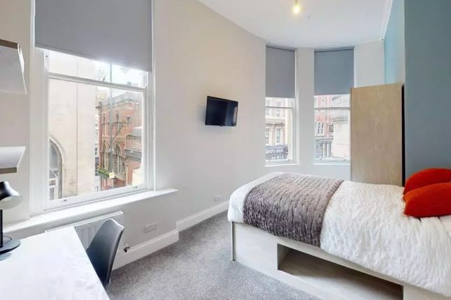 A Bright And Inviting Double Bedroom Featuring Lar...