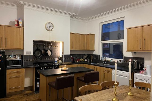 Well-Equipped Kitchen With An Island Breakfast Bar...