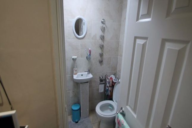 A Clean And Well-Maintained Bathroom With A Toilet...