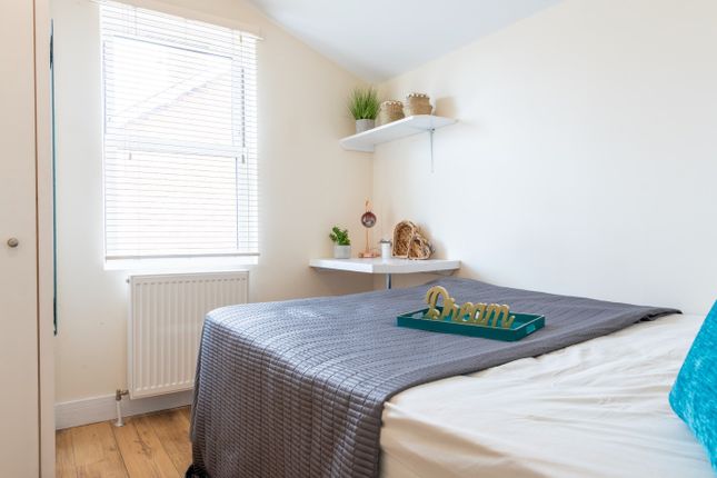 A Cozy Double Bedroom Featuring A Comfortable Bed ...