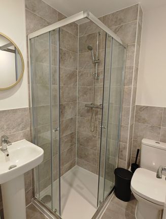 Modern Bathroom Featuring A Clean, Glass-Enclosed ...