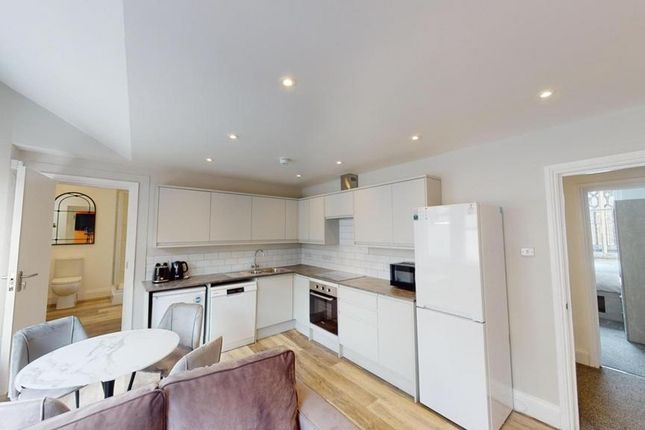 A Modern And Clean Kitchenette With Ample Storage ...