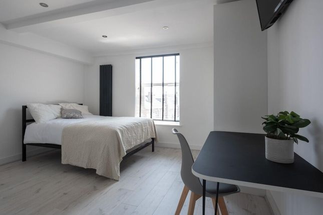 A Bright And Spacious Master Bedroom Featuring A c...