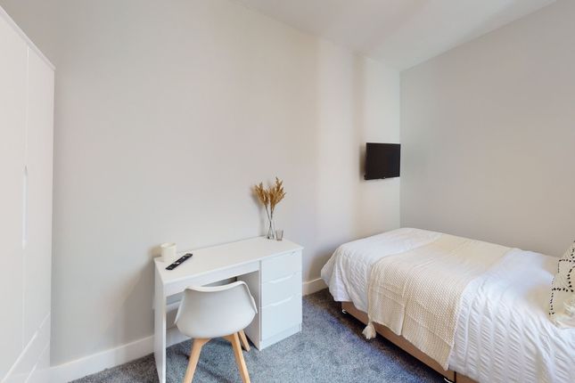 A Bright And Inviting Double Bedroom Featuring A c...