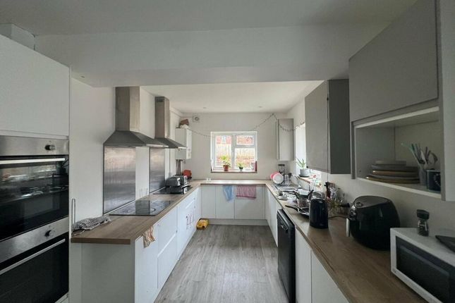 Bright And Modern Kitchen Featuring Ample Countert...