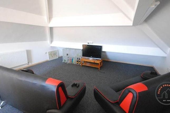 A Cozy Cinema Room Equipped With Comfortable Seati...