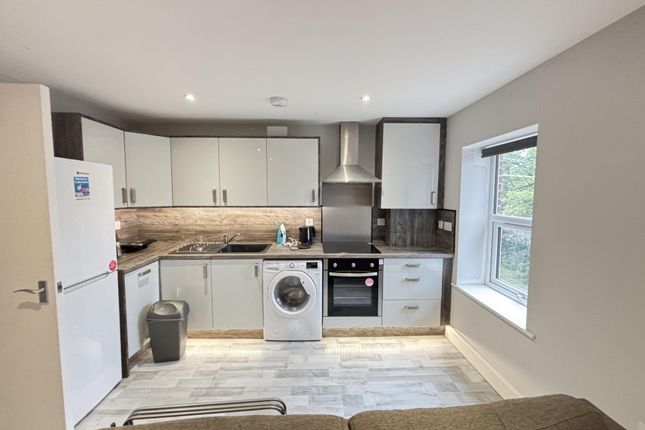 Bright Open-Plan Kitchen With Modern White Cabinet...