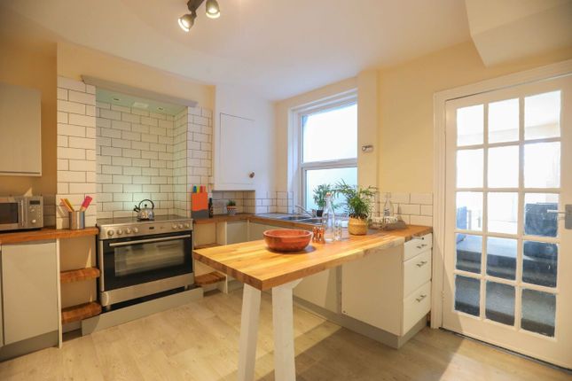 Bright And Welcoming Kitchen Featuring Natural Lig...