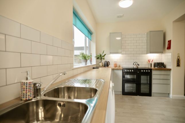 Bright And Modern Kitchen With A Clean Countertop,...