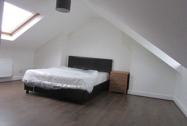 Bright And Spacious Attic Bedroom Featuring A Comf...