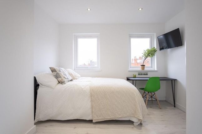 Bright And Airy Bedroom Featuring Two Clean Window...