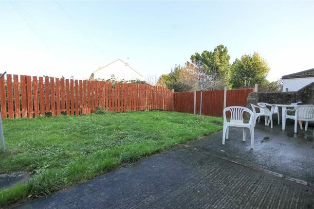 A Well-Maintained Garden Featuring A Lush Green La...