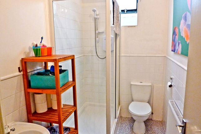 A Modern Bathroom Featuring A Spacious Shower, Sty...