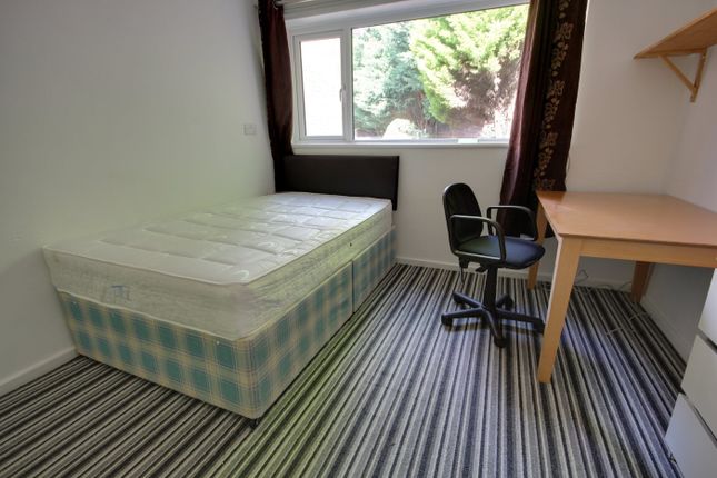 A Bright And Tidy Double Bedroom Featuring A Comfo...