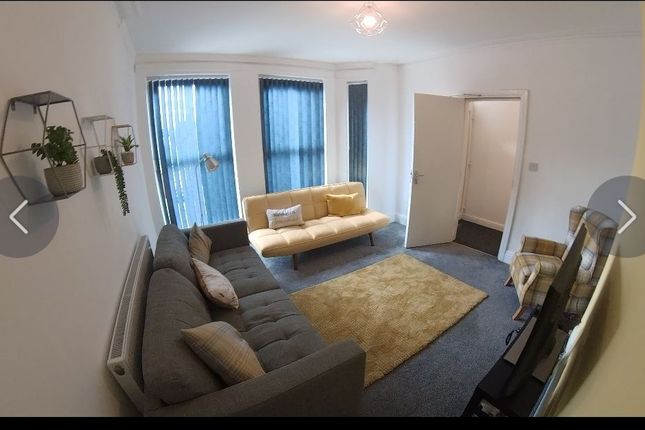 A Cozy Living Room Featuring Two Comfortable Sofas...